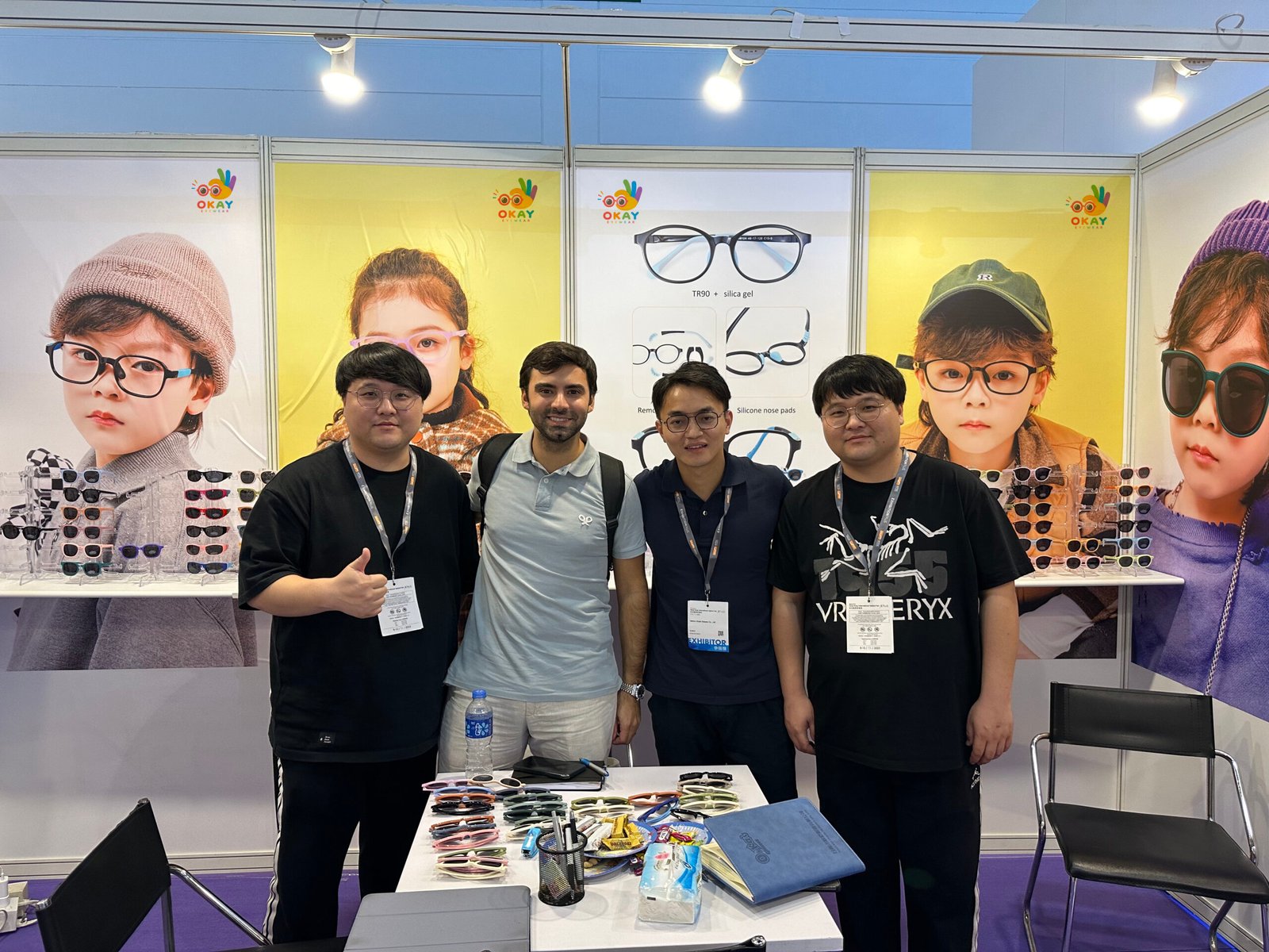 Distributor from Spain visiting the OKAY EYEWEAR booth with the production team
