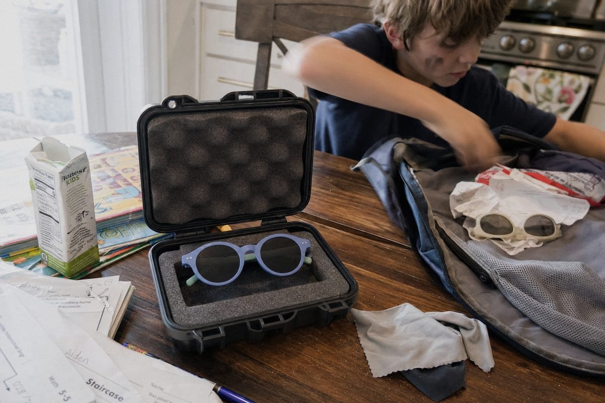 Hard-shell case storage prevents scratches on kids' sunglasses lenses (ID#2)