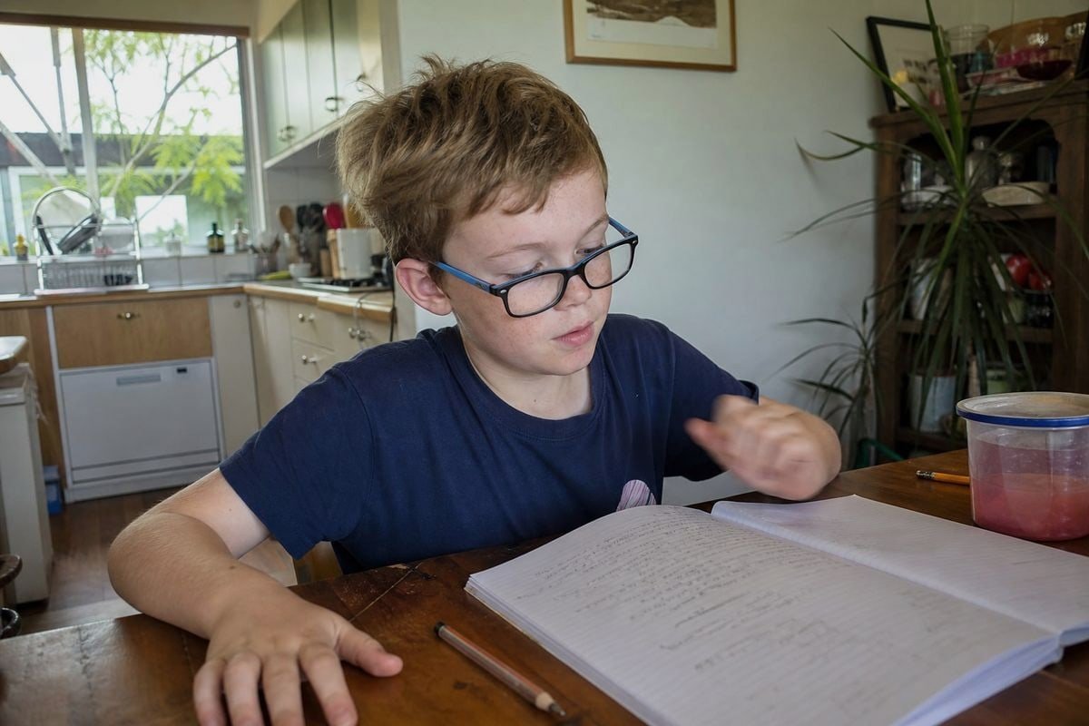 Child wearing glasses showing why optical center alignment matters more for developing vision (ID#3)
