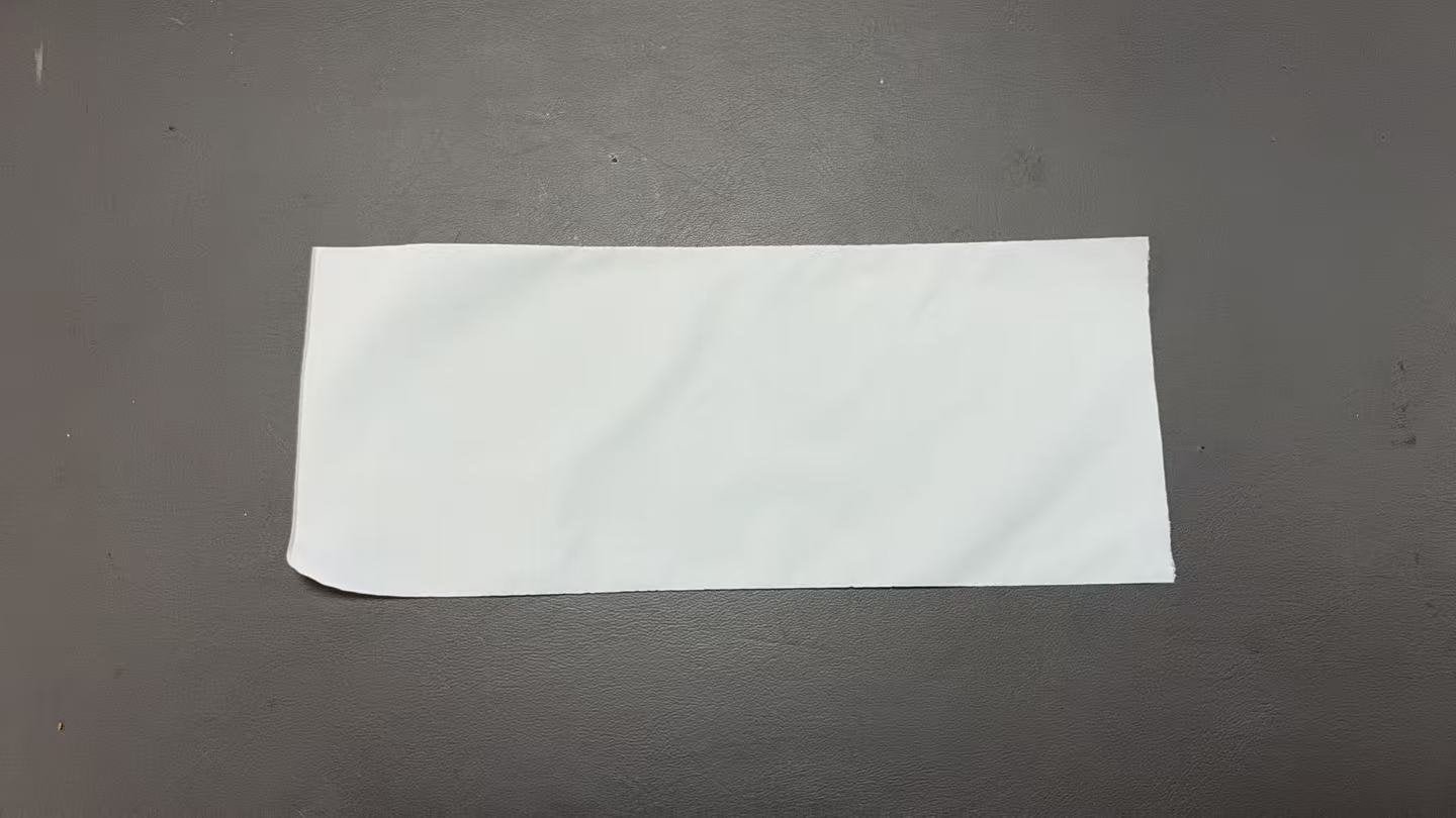 Milky-white open-top PLA inner bag without a seal or snap closure — real packaging sample