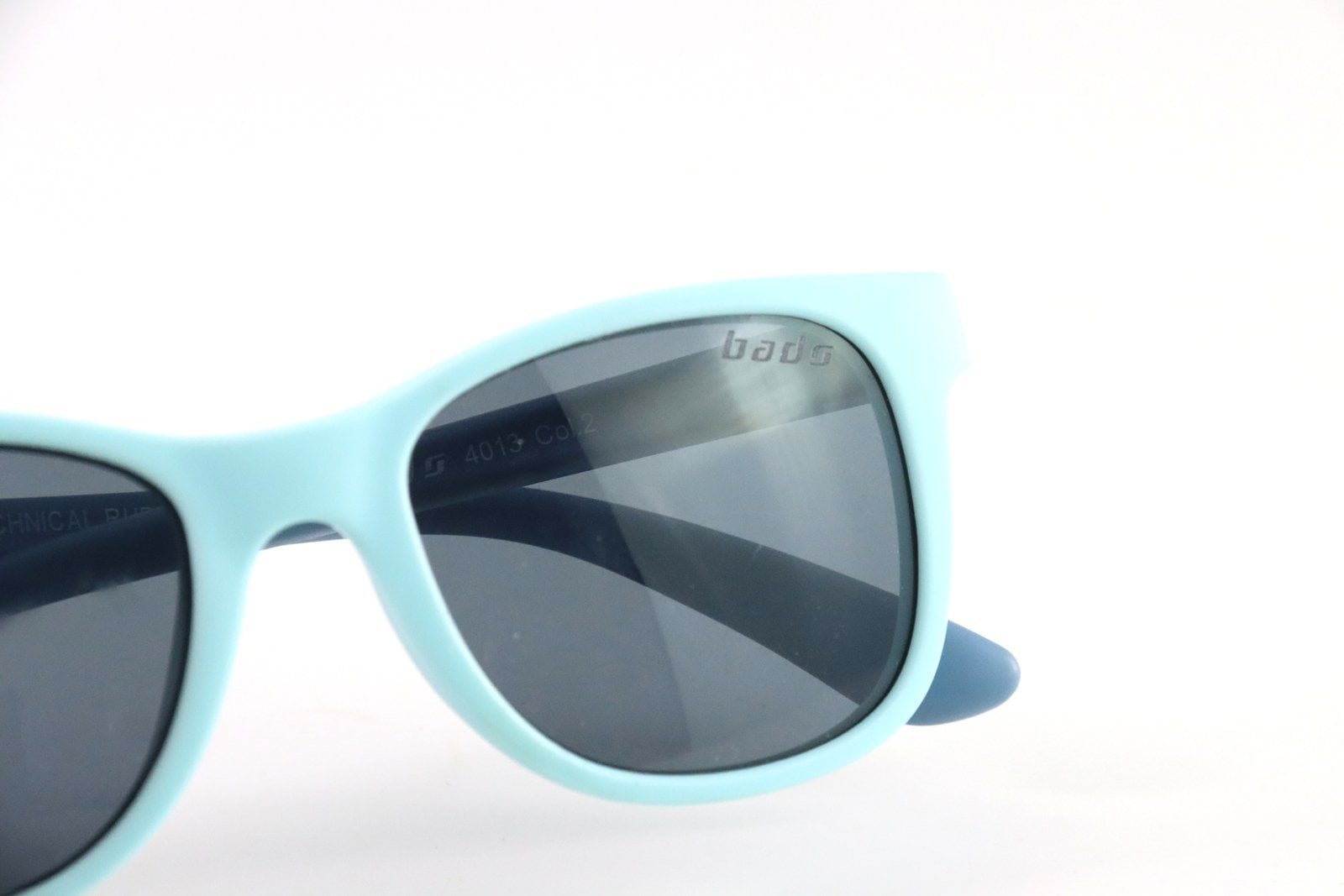 Actual sample of a laser-marked logo on a sunglass lens