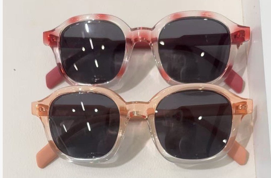 Actual samples of pink and peach spray-colour eyewear frames